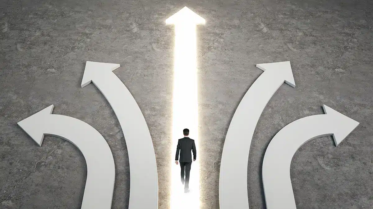 man walking on a glowing arrow graphic